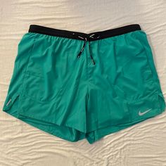 Brand New Nike Standard Fit 5” Length Green Running Shorts Pocket In Back Of Shorts Shorts On Gray On My Page As Well Green Short Activewear For Running, Green Stretch Swim Trunks With Go-dry, Stretch Bottoms With Pockets For Running Errands, Nike Swim Trunks With Built-in Shorts, Green Short Activewear For Outdoor, Green Short Outdoor Activewear, Nike Green Athletic Shorts With Built-in Shorts, Nike Stretch Athletic Shorts With Pockets, Green Training Shorts With Elastic Waistband