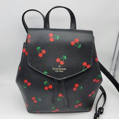 Brand: Kate Spade Style: Lizzie Tossed Cherry Printed Medium Flap Backpack / K6390 Condition: New With Tag Exterior Color: Black Multi Interior Features: Inside Zip And Multifunction Pockets Closure: Magnetic Snap Hardware Color: Gold Straps: One Top Handle And Two Shoulder Straps Approx. Measurements: 9.75" L Across Widest Point (Or 8.25" Across Bottom) X 10" H X 4.5" W No Lowball Offers Or Trades Please. I Do Not Discuss Prices On Listings. Thank You For Looking! Trendy Red Kate Spade Bag, Kate Spade Satchel Backpack, Kate Spade Black Backpack With Removable Pouch, Kate Spade Black Backpack With Detachable Strap, Kate Spade Black Backpack For On-the-go, Kate Spade Black Backpack For Errands, Casual Kate Spade Bag For School, Casual Kate Spade Standard Backpack, Trendy Black Leather Backpack For Errands