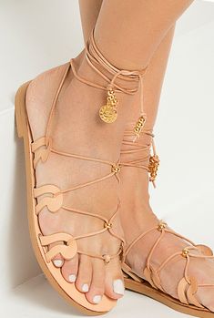 Our signature Danae gladiator sandals are inspired by the ancient Greek wave motif as it also appears in our logo. This pair is made from chemical-free vegetable-tanned leather with adjustable slim ties that can be worn high up or low at your ankles, detailed with gold plated beads and coins. These top quality lace up sandals have anti-slip rubber sole for optimum comfort suitable for everyday wear from day to night and the neutral shade will complement just about everything. Available in 5 colo Wedding Sandals For Bride, Sandals Greek, Tie Up Sandals, Tan Leather Sandals, Womens Gladiator Sandals, Boho Sandals, Bridal Sandals, Sandals Flat, Brown Leather Sandals