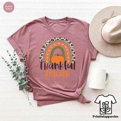 Thankful Teacher T-Shirt, Thanksgiving Rainbow Teacher Shirt, Thankful Gift For Teacher, Teachers Pumpkin Season Outfit, Fall Teacher Gift Welcome to my shop, I am a professional designer and craft my own shirts. I started this journey from scratch and have gained lots of experience. I can craft custom shirts with custom designs. Our handmade, specially designed shirts will be the perfect choice for your celebrations, vacations, graduations or birthday & wedding parties and holidays.  Discount a Basic Pink T-shirt For Fall, Pink Graphic Tee With Heat Transfer Vinyl, Fall Teacher Gifts, Designed Shirts, Thanks For The Gift, Pumpkin Season, Pumpkin Seasoning, Wedding Parties, Gift For Teacher