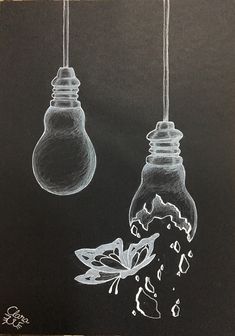 two lightbulbs hanging from strings in front of a blackboard with white ink