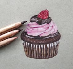 a drawing of a cupcake with pink frosting and a raspberry on top