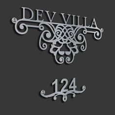 the name and number for dev villa on a black background with white lettering in silver