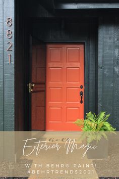 an orange door with the words extreme magic written on it in front of a black building