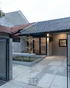 an outdoor courtyard area with concrete walls and tiled roof