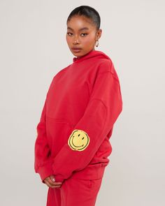 OFFICIAL COLLABORATION WITH SMILEY® Our latest hoodie is made from a super comfy heavyweight french terry fabric that has raw edge smiley patches on the elbows. Designed with comfort in mind, this is going to keep you cozy all season. Details: 12 oz French terry Oversized fit Raw edge smiley patches Panel inserts on sleeves Kangaroo pocket on the front The model is 5'7" wearing a size small Care Instructions: Wash cold, tumble dry low Do not use chlorine bleach Hang dry in a well-ventilated area Trendy Red Hoodie For Loungewear, Red Trendy Hoodie For Loungewear, Red Oversized Hoodie With Crew Neck, Trendy Oversized Red Hoodie, Oversized Trendy Red Hoodie, Trendy Red Oversized Hoodie, Red Oversized Sweatshirt For Loungewear, Red Oversized Crew Sweatshirt, Oversized Red Cotton Hoodie