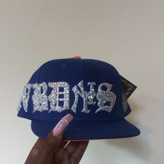 Custom Mix Size Full Bling Out Crystal Famous Nobody's Old English Embroidery Snapback Hat. Super Detail. 2 Other Colors Also Available, Hats Are Made To Order (This One Is Ready To Ship), Please Allow 2 Weeks To Ship For Custom Orders. Personal Hat, I Wasn't Looking To Sell But Only Willing To Sale For Asking Price. Price Includes The Cost Of This Limited Edition Twenty Two X Famous Nobody Hat (X Marks The Spot). Video Taken Without Flash. These Pics Doesn't Do This Hat Any Justice. Fitted Hat Aesthetic, Fitted Hats Women, Bedazzled Hat, Custom Snapbacks, Customized Hats, Y2k Hats, Rhinestone Hat, Embroidery Hats, English Embroidery