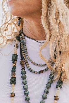 The Terry Amazonite Layering Necklace ♡ Product Highlights ♡ Our Terry Amazonite Layering Necklace is the perfect accessory to add to any on-trend bohemian style outfit! Layered with any of our many statement necklaces, earrings, and bracelets, of your choosing, the Terry Amazonite Layering Necklace will be sure to be a wonderful addition to bohemian and stylish outfit! ✁ Contents & Measurements ✁ Our Terry Amazonite Layering Necklace features: • A 14 to 32 inch genuine leather chord, for an adj Necklace Layers, Pearl Jacket, Bohemian Style Clothing, Iconic Dresses, African Beads, Handbag Accessories, Layered Necklaces, Bohemian Style, Gemstone Beads