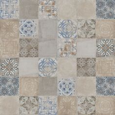 a patchwork design with blue, beige and brown colors on the outside of it