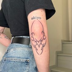 a person with a tattoo on their arm