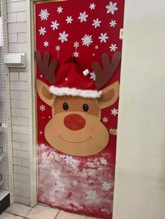 a door decorated with a reindeer's head and snowflakes on the side