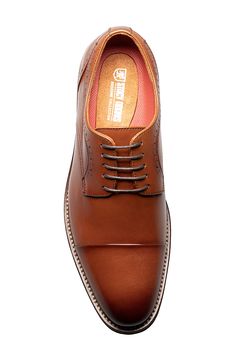 Broguing and burnished details accent a round cap toe lace-up that features anatomical arch support. Round cap toe Broguing details Lace-up Arch support removable insole Leather upper, manmade sole Imported Cognac Cap Toe Dress Shoes Goodyear Welted, Luxury Cognac Oxfords For Semi-formal Occasions, Cognac Wingtip Oxfords For Semi-formal Occasions, Semi-formal Cognac Leather Oxfords, Luxury Brown Semi-formal Oxfords, Arch Support, Cognac, Derby, Leather Upper