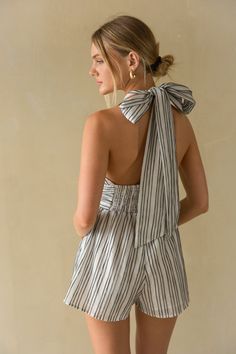 Straight from the Hamptons, the Solene Striped Linen Halter Romper is a beachy must-have for a fruitful Summer! This linen romper features a tie halter top, pinstripe pattern, and open back. Plus, it has pockets! Accessorize to complete the look!Details: Self: 100% Polyester Lining: 100% Polyester Double Lined Tie Halter Neckline Pockets Hand Wash Cold/ Lay Flat to Dry Tie Halter Top, Open Backs, American Threads, Pinstripe Pattern, Halter Romper, Linen Romper, Bogo Sale, Striped Linen, Halter Neckline