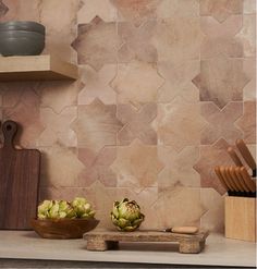 a kitchen counter topped with bowls and cutting boards