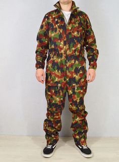 Unisex Vintage Swiss Coveralls Boilersuit Alpenflage Colourful Camo Pattern - Medium Original vintage Swiss camo army overalls with chunky silver zip and eye catching colourful Alpenflage camo design, loads of pockets, zipped cuffs and ankles. Thick high quality fabric. One of a kind and very limited quantities available. DETAILS - 7 pockets: 2 slanted on the chest, 1 on left arm, 1 on each thigh and 1 on either hip. The hip pockets also allows access to garments underneath via a popper. All poc Military Style Khaki Jumpsuit, Military Style Long Sleeve Khaki Jumpsuit, Khaki Military Long Sleeve Jumpsuit, Khaki Military Style Long Sleeve Jumpsuits, 1 Am, Camo Designs, Boiler Suit, Lower Leg, Camouflage