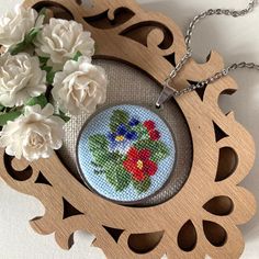 Embroidered viola necklace is a wonderful gift for women. Jewelry pendant with red and a blue viola flower perfect gift for mother, daughter or wife. Floral jewelry perfect for every day and for a special occasion.  This pendant is made in the technique of micro-embroidery cross stitch on cotton canvas with cotton threads.  The size of each stitch is less than 1 mm. MATERIALS: The color of the base and chain-silver (not silver plated), material-stainless steel, lobster claw clasp.  Canvas Zweiga Handmade Flower Pendant Necklace For Mother's Day, Handmade Flower Necklace Gift, Handmade Necklaces For Mother's Day Crafting, Handmade Flower Pendant Necklace For Mom, Handmade Flower Pendant Necklace As Gift For Mom, Blue Flower Necklace Gift, Handmade Purple Flower Necklace For Gift, Handmade Blue Necklaces As Gift For Mom, Handmade Flower Necklace As Gift For Mom