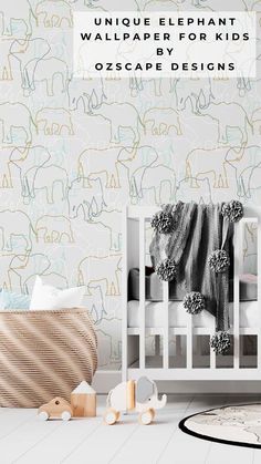 a baby crib in front of a wallpaper with elephants on it and the words unique elephant wallpaper for kids