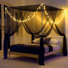 a bed that has some lights on it