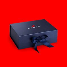 a black box with a blue bow on it