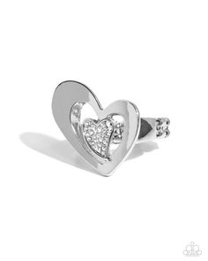 Embellished in glistening white rhinestones, an abstract silver heart is centered inside an oversized, abstract, sleek silver heart atop the finger for a radically romantic look. Features a dainty stretchy band for a flexible fit.   Sold as one individual ring. Elegant Silver Rings With Heart Charm, Silver Rings With Heart Charm And Elegant Style, Modern Sterling Silver Heart Ring, Silver Heart-shaped Metal Ring, Valentine's Day Diamond Heart Ring In Silver, Valentine's Day Silver Heart Diamond Ring, Valentine's Day Silver Heart Ring, Silver Diamond Rings With Open Heart Design, Silver Diamond Heart Ring For Valentine's Day