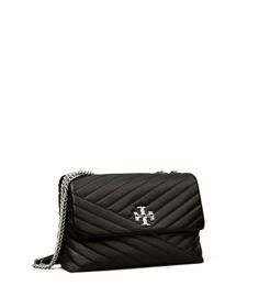 Directly from Tory Burch - The Kira Convertible Shoulder Bag is made of soft chevron-quilted leather with beveled Double T hardware. An adjustable chain strap adapts in the moment - doubled over the shoulder, or long and crossbody. Tory Burch Official Site. Kira Chevron Convertible Shoulder Bag, Tory Burch Kira Chevron, Kira Chevron, Tory Burch Kira, Womens Designer Handbags, Leather Roll, Designer Shoulder Bags, Quilted Leather, Chanel Boy Bag