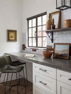 the kitchen counter is clean and ready to be used as a dining room table or bar