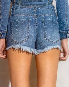 Enhance your wardrobe with these So Dramatic Rhinestone Denim Shorts. The mid rise cut offers a comfortable fit while the all over rhinestone detailing adds a touch of trendiness to your look. The distressed leg opening hem adds a touch of edge to your style. Perfect for any casual occasion. (S) Rise:9.5', Inseam: 3" Model is 5'5" and wearing a size small. Straight Leg Denim Bottoms With Sequins, Straight Leg Denim Sequined Bottoms, Sequined Straight Leg Denim Bottoms, High Rise Denim Bottoms With Rhinestones, Glamorous Straight Leg Denim Bottoms, Stretch Bottoms With Rhinestones For Spring, Spring Stretch Bottoms With Rhinestones, Trendy Mid-rise Bottoms With Rhinestones, Spring Bottoms With Rhinestones In Medium Wash