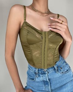 Give your wardrobe the boost it needs! This green corset features the cutest satin and lace detailing, adding a touch of glamour to any outfit. Elevate your style and feel confident and beautiful in our stunning Kailey Corset Top. More Details: - Fits true to size for most - Minimal stretchy - Fitted - Cropped - Adjustable straps - Hook eye closure in the front - 100% POLYESTER - Color may vary due to the lighting Model Details: Height 5'7 | Chest 34" Cup size C | Waist 27" Hips 36.5" | Weight 1 Corset And Jeans Outfit, Corset And Jeans, Outfit Ideas Spring, Green Corset, Summer Outfit Ideas, Summer Styles, Favorite Season, Fashion Spring, Spring Wardrobe