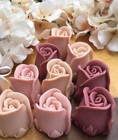 some pink and purple flowers are on a table