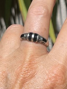 This is a really beautiful sterling silver and black onyx Gemstone band ring. It also has several marcasite's. Very art deco looking. It is approximately 7.75. Please see photos for additional measurements and details. Black Sterling Silver Jewelry With Inlay, Black Ring With Inlay, Black Rings With Inlay, Black Inlay Round Ring, Elegant Black Rings With Inlay, Black Hallmarked Enamel Ring For Anniversary, Hallmarked Black Enamel Ring For Anniversary, Art Deco Silver Rings With Black Enamel, Beautiful Rings Vintage