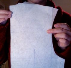 a person holding up a piece of paper