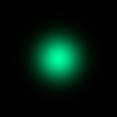 a black background with a green light in the middle