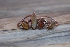 Raw Citrine Ring, Crystal Stackable Rings, Electroformed Jewelry ------------------------------------------ :: D E T A I L S :: This listing is for one handmade ring with a raw Citrine crystal. These are unique and look great with any outfit! Please select the size you would like from the drop-down menu. These unique rings were created through a process known as electroforming, or growing copper onto an object using positive and negative currents. Copper amplifies the energies of all crystals/st Copper Electroformed Jewelry, How To Wear Rings, Raw Citrine, Raw Gemstone Jewelry, Raw Stone Ring, Raw Crystal Jewelry, Ring Crystal, Tiny Rings, Crystals Stones