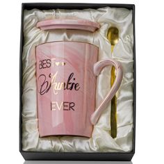 a pink coffee mug in a gift box