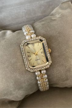 Introducing our Pearl Grain Women's Wristwatch, a perfect fusion of vintage charm and modern elegance. With a case diameter of 26-30mm, this dainty watch is designed to adorn your wrist with grace and sophistication. Crafted from high-quality metal, both the case and cord offer durability while ensuring a lightweight feel. This vintage pearl women's watch features a stunning pearl design, making it a standout piece in any jewelry collection. The delicate gold watch accents add a touch of luxury, making it an ideal choice for any occasion--be it a night out, a wedding, or a casual brunch. Looking for a thoughtful New Year gift for women or a charming anniversary gift? This elegant pearl watch is sure to impress. It's also a wonderful option for bridesmaids gifts, offering a timeless piece t Dainty Watch, Watch Women, Watch Vintage, Vintage Pearl, Pearl Design, New Year Gift, Vintage Pearls, Women Wrist Watch, Women's Watch