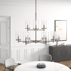 a dining room table with chairs and a chandelier