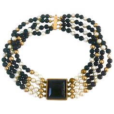 This striking choker is comfortable and easy to wear. The black onyx center is embellished with 4 strands of pearls, 14k gold beads and black onyx beads. Although it was made in the 1990's the design is timeless.This is a definite head-turning piece of jewelry for your casual and formal wear. Gold Chocker Necklace, South Sea Pearl Necklace, Pearl Strands Necklace, Snake Necklace, Pearl Choker Necklace, Gold Choker Necklace, Gold Choker, Real Pearls, Onyx Bead