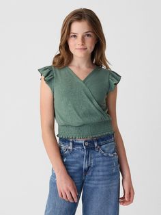 Soft cotton blend top.  V-neck.  Short flutter sleeves.  Wrap detail at front.  Smocked hem.  Slim fit.  Hits at the hip. Kids Wrap, Decorations Bedroom, Kids Wraps, Foundation Stick, People Clothes, Headshot Photography, Gap Kids, Women Outfits