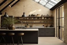 a kitchen with two stools next to an island and shelves filled with pots and pans