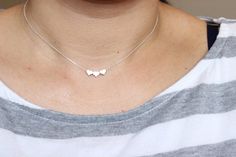 This heart necklace doesn't have initial on it. If you want the initial heart necklace, please follow the link to see itInitial heart necklace:https://www.etsy.com/listing/236533468/tiny-dainty-initial-heart-necklace?ref=shop_home_active_1&ga_search_query=heart%2BnecklaceYou can add more than one heart charm to the necklace. Please select the number of heart charm you want at the drop out menu. Also availalbe in bracelet and anklet. Please go to my shop to see the listings or if you have any que Dainty Silver Heart Pendant Initial Necklace, Dainty Sterling Silver Heart Initial Necklace, Dainty White Necklace For Best Friend Gift, Minimalist Heart Charm Necklace For Best Friend, Heart Shaped Minimalist Charm Necklace For Best Friend, Cute Sterling Silver Charm Necklace, Heart Shaped Charm Necklaces For Best Friend, Dainty Heart Pendant Necklace For Best Friend, Heart-shaped Charm Necklaces For Best Friend