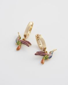 Flutter through your day with our Hummingbird Huggies. These hand-painted enamel charms dangle delicately from lobe-hugging hoops, symbolising joy and resilience. Perfect for adding a touch of nature’s magic to your outfit, they inspire you to find happiness in the smallest details.


Key features:


22ct Worn-gold plated brass, zinc alloy, enamel.



Hoop outside diameter 13mm; Charm: 10.5mm height x 14.8mm width



Wipe clean with a soft cloth Hummingbird Earrings, Find Happiness, Bottega Veneta Shoulder Bag, Enamel Charms, Small Detail, Louis Vuitton Shoulder Bag, Zinc Alloy, Cleaning Wipes, Jewelry Box