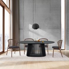 a dining table with four chairs around it