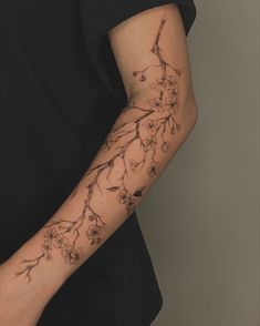 a person with a flower tattoo on their arm