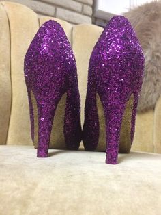 Royal purple covers the entire top portion of the heels while the underside is covered in an ultra-fine yellow gold glitter. These heels can be made in any color combo desired. If you would like another color combination please leave your color choices at checkout. This heel is available in additional colors and shoe styles. Contact us today for more color and style options. All heels are handmade and shipped out within 1-2 weeks of the purchase date. We always welcome new designs and love to wo Purple Open Toe Party Heels, Purple Open Heel Heels For Party, Glamorous Purple Party Heels, Purple Wedding Shoes For Party, Purple High Heel Party Heels, Glamorous Purple Heels For Wedding, Purple Pointed Toe Heels For Gala, Glamorous Purple High Heels, Purple Party Heels