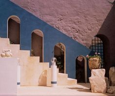 a blue and white building with steps leading up to it's entrance area,