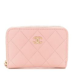 This is an authentic CHANEL Caviar Quilted Zip Coin Purse in Light Pink. This petite wallet is crafted of pink caviar leather. This purse features a wrap-around zipper and a gold CC logo on the front. The zipper opens to a matching fabric interior. Round Coin Purse, Chanel Caviar, Chanel Wallet, Coin Pouch, Purse Pouch, Cc Logo, Pink Fabric, Light Pink, Coin Purse