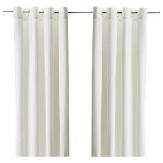 two white curtains hanging on a metal rod