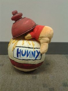 a stuffed animal sitting on top of a ball with the word knump written on it