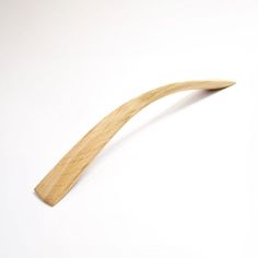 a wooden toothbrush on a white background