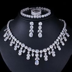 Elevate your prom look with this fashion bridal necklace set. The set includes a stunning necklace and matching accessories, adding a touch of elegance and sophistication to your ensemble.
– This bridal a plus cubic zirconia gemstone necklace set is perfect for adding elegance to any bridal ensemble.– Made with high-quality materials, this set includes a stunning necklace and matching earrings for a complete look.– Perfect for pageant, bridal, bridesmaid, prom, quinceañera or special occasion. Prom Jewelry Sets, Crystal Bridal Jewelry Sets, Zircon Necklace, Silver Necklace Set, Bridal Necklace Set, Bridal Jewelry Set, Prom Jewelry, Dangle Necklaces, Women's Jewelry Sets